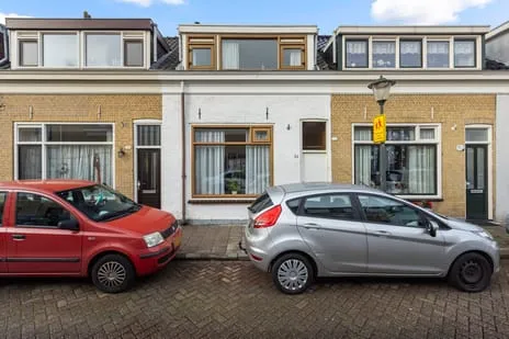 Tussenwoning te koop: Puttershoeksestraat 34, Eilandenbuurt Schiedam
